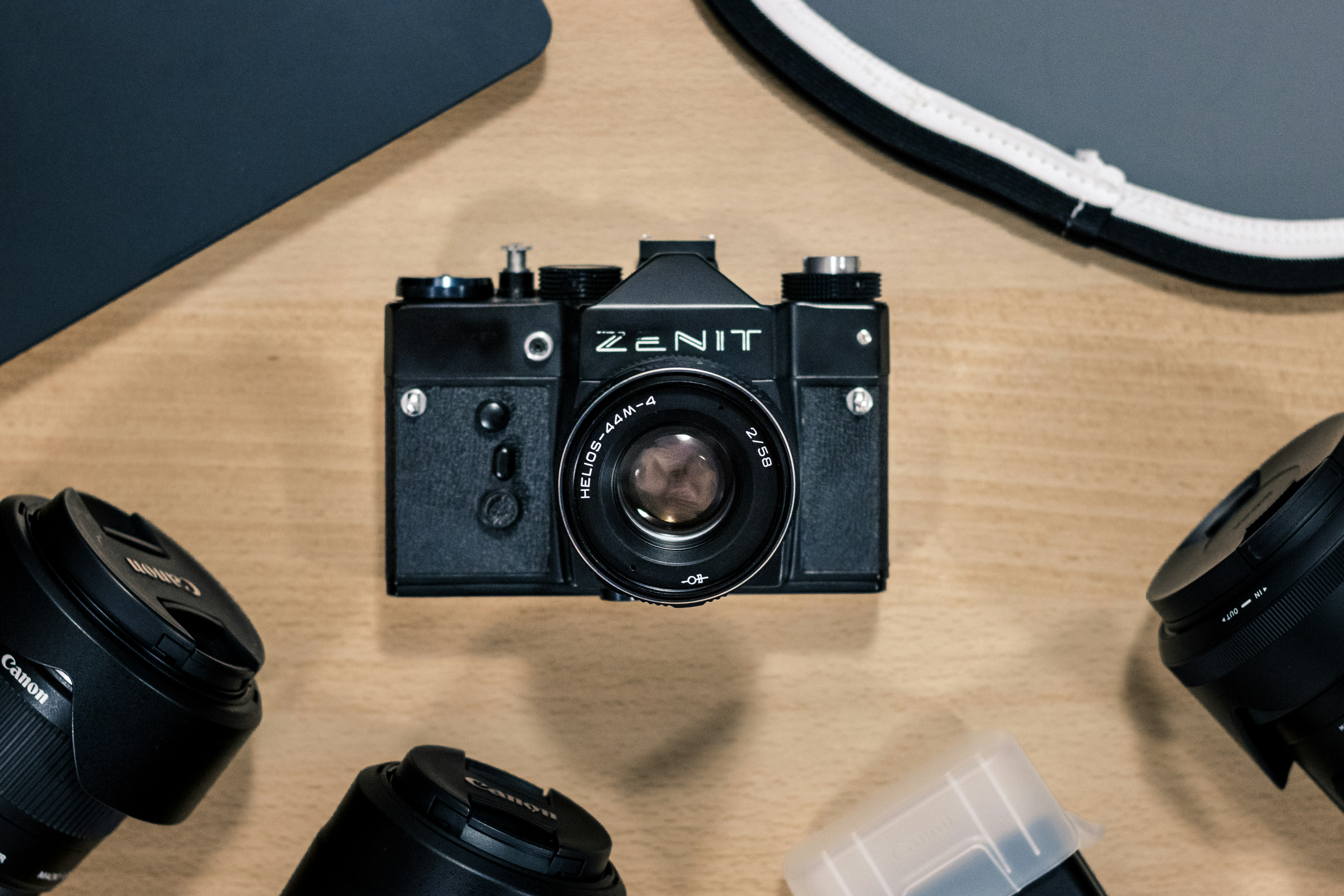 black nikon dslr camera on brown wooden table